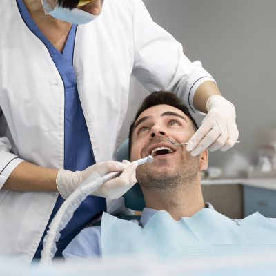 dentist-doing-a-check-up-on-the-patient